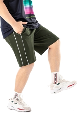 Plus size sports shorts in green color.