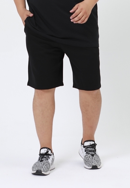 Plus size plain cotton sweat shorts in black color.