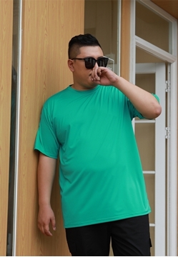 Plus size basic dry fit t-shirt in green color.
