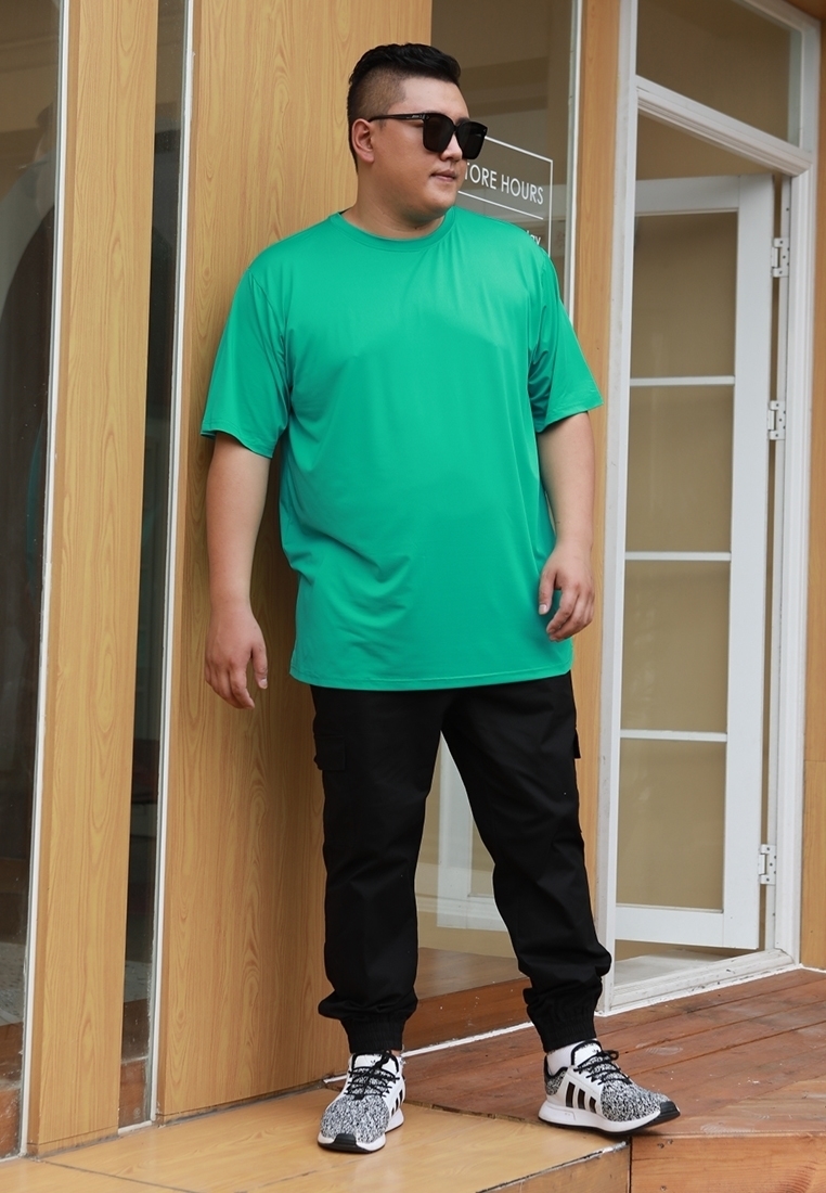 Plus size basic dry fit t-shirt in green color.